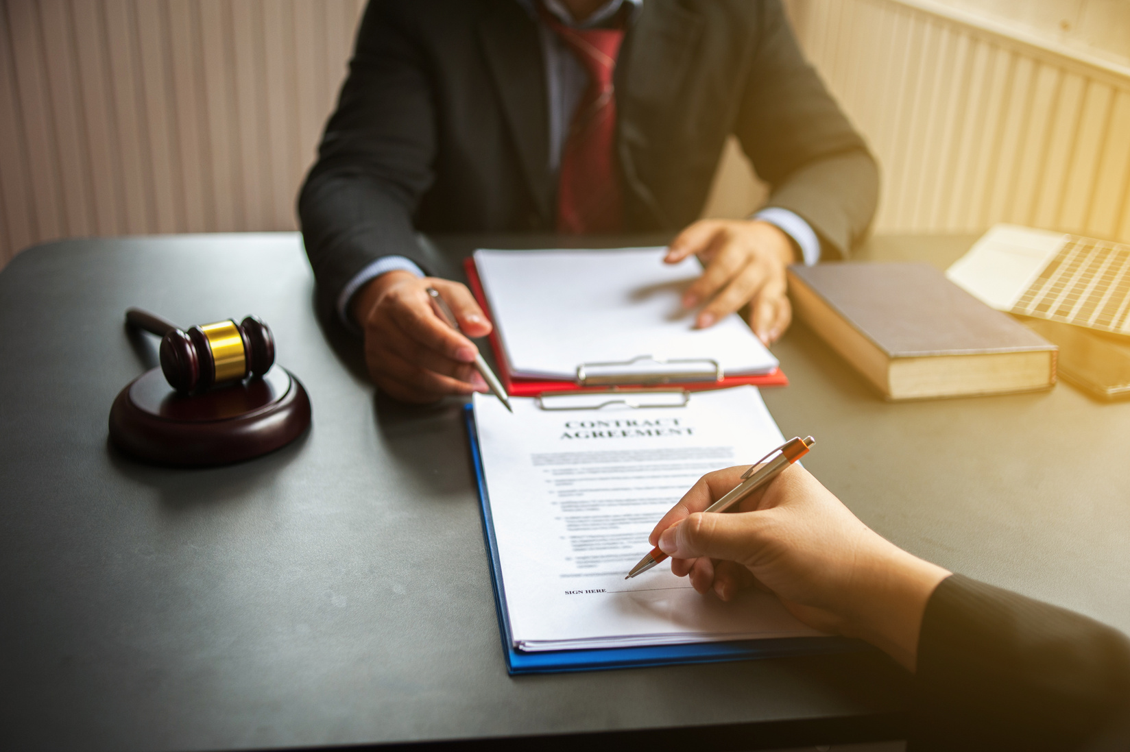 business people and lawyers discussing contract papers.Legal planning. Concepts of law, advice, legal services.